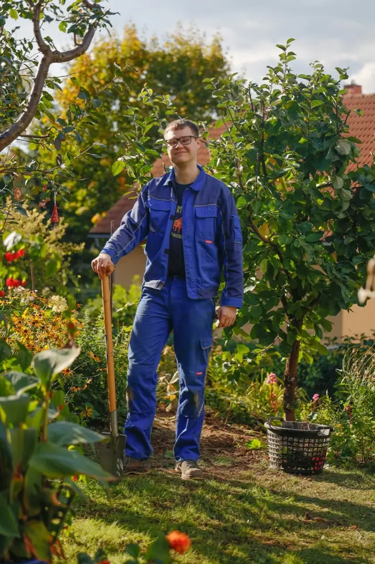 Gardener working a flowerbed in Carson, CA